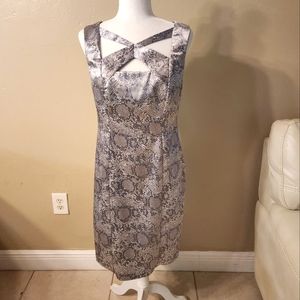 Alligator print criss cross kneckline dress. Silky material full zip in back